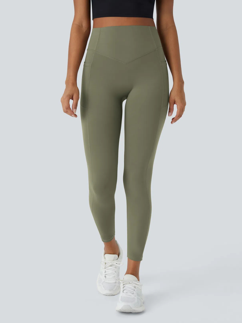 Leggings de tiro alto con bolsillo lateral y efecto moldeador