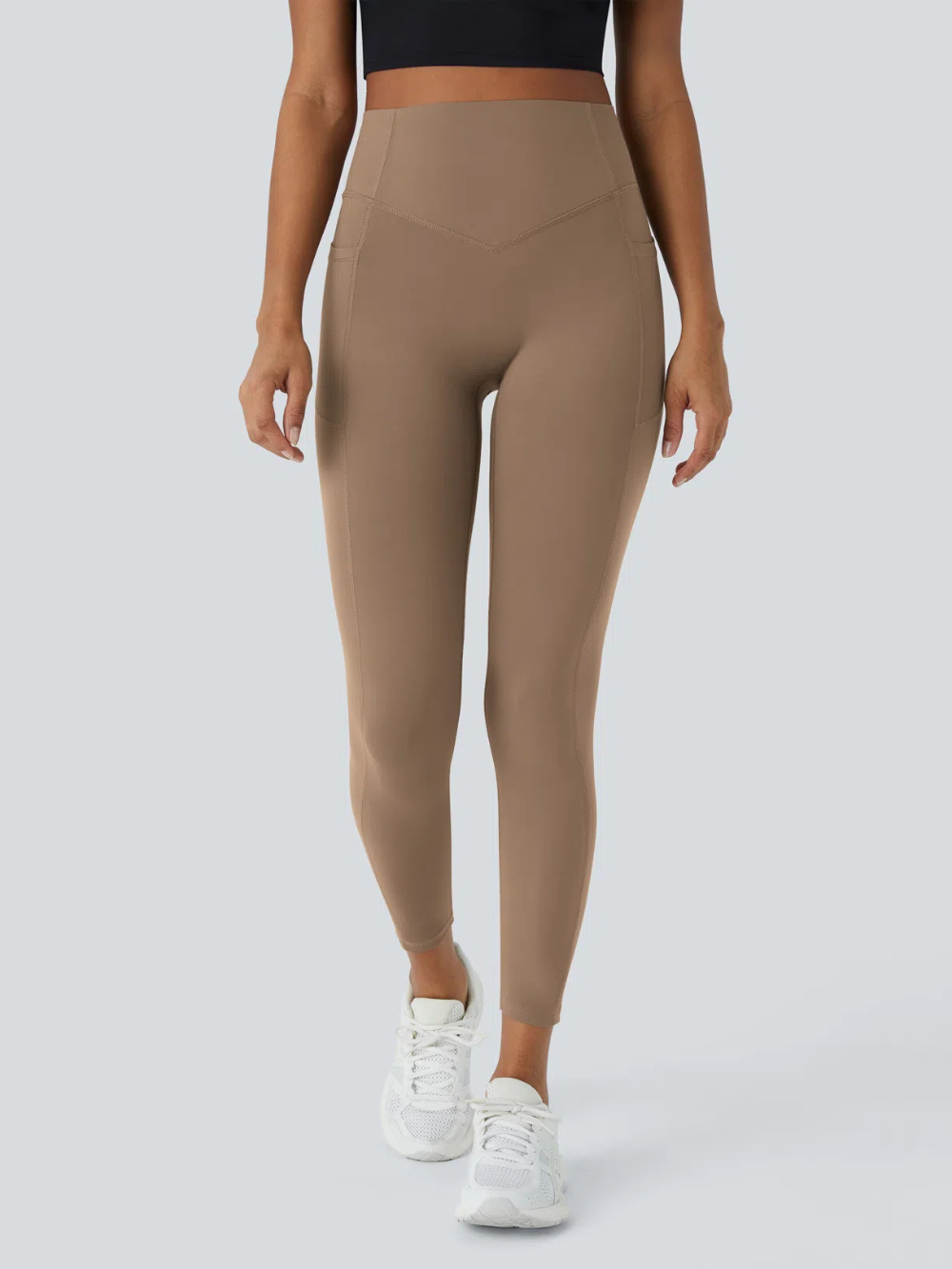 Leggings de tiro alto con bolsillo lateral y efecto moldeador