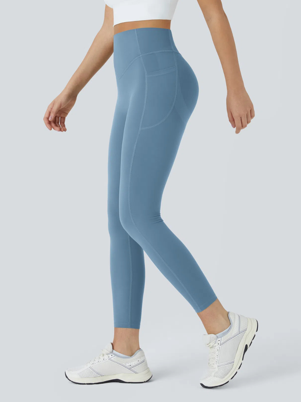 Leggings de tiro alto con bolsillo lateral y efecto moldeador