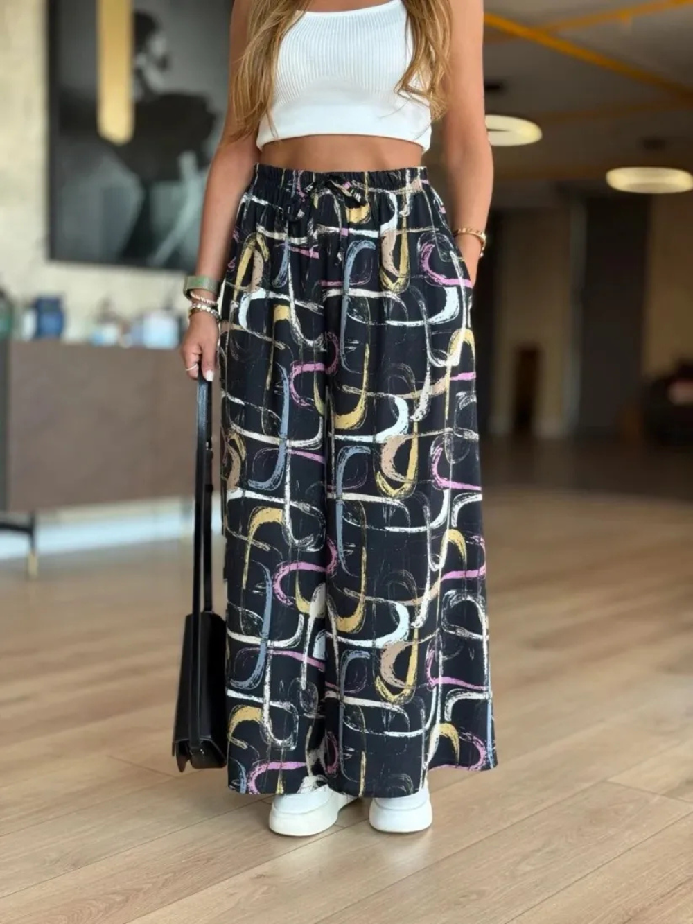 Pantalón palazzo con cintura elástica y estampado